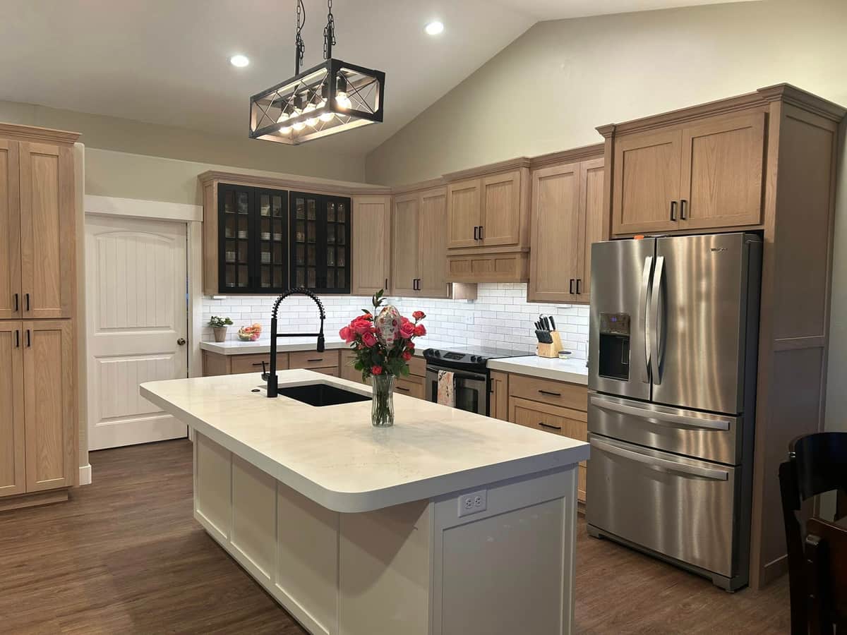 Bright kitchen with light wood cabinets and a white quartz island